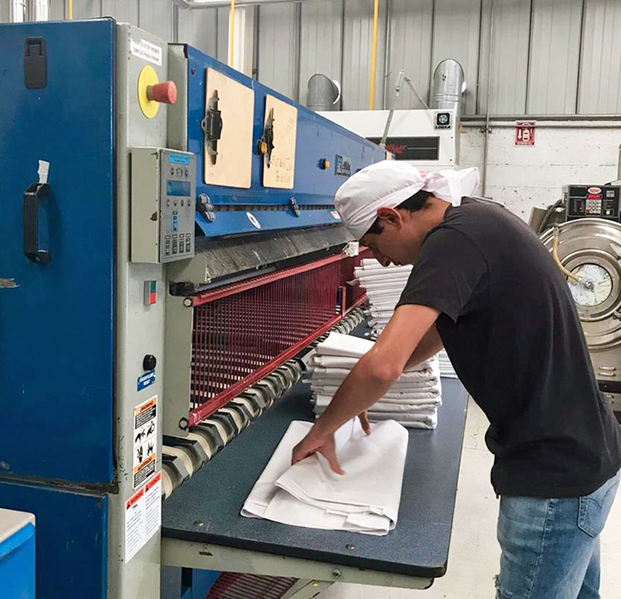 Lavanderia y tintorería Industrial Quality logo